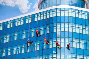 Washers Cleaning Office Building Windows